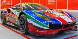 Colorful Ferrari race car in garage