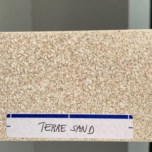 Textured beige stone sample labeled 'Terre Sand'.