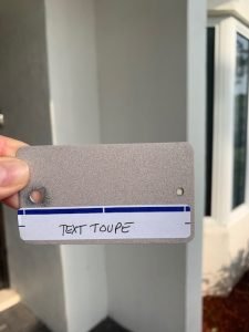 Gray textured paint swatch labeled 'Text Taupe'