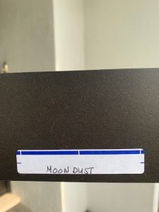 Label reads 'Moon Dust' on black surface.