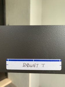 Label with handwritten name 'BROWN T'