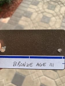 Bronze metallic sample labeled Bronze Age III