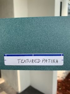 Green textured patina color sample card.