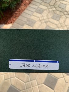 Green sign with 'Jade Crater' label.