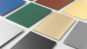 Colorful metal sheets arranged on a white surface.