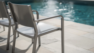 Metal chair by a swimming pool