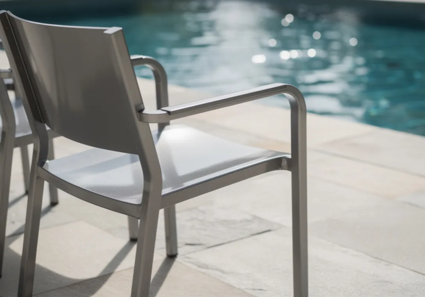 Metal chair by a swimming pool